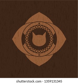 cat face icon inside realistic wooden emblem
