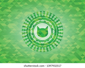 cat face icon inside realistic green mosaic emblem