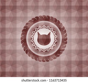cat face icon inside red seamless emblem or badge with abstract geometric polygonal pattern background.