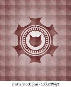 cat face icon inside red seamless badge with geometric pattern.
