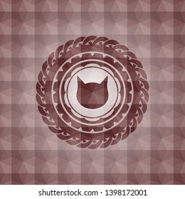 cat face icon inside red seamless badge with geometric pattern.