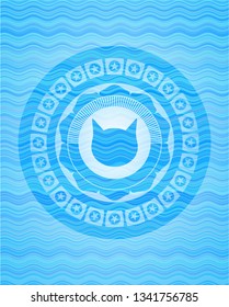 cat face icon inside sky blue water wave badge.