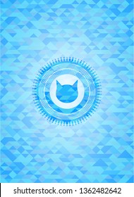 cat face icon inside sky blue emblem with triangle mosaic background