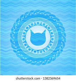 cat face icon inside sky blue water wave style badge.