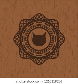 cat face icon inside wood badge or emblem