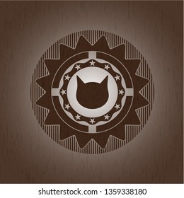 cat face icon inside wood badge or emblem