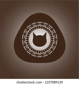 cat face icon inside wooden emblem