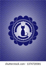 cat icon inside badge with denim texture