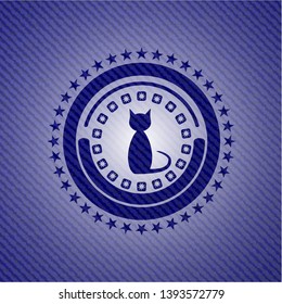 cat icon inside badge with denim texture