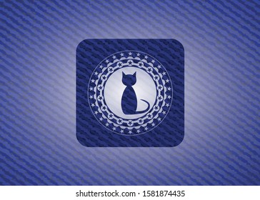 cat icon inside badge with denim background