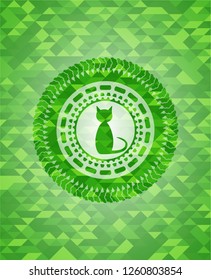 cat icon inside green emblem with mosaic background