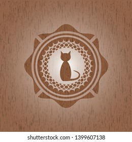 cat icon inside realistic wooden emblem