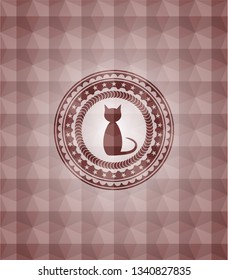 cat icon inside red seamless emblem or badge with abstract geometric pattern background.