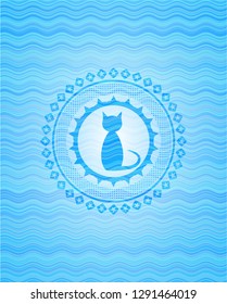 cat icon inside sky blue water wave emblem background.
