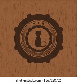 cat icon inside wooden emblem