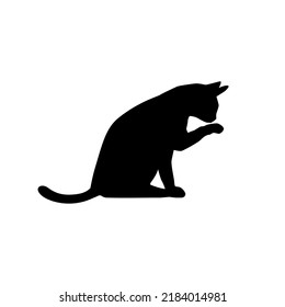 Cat licking its paw isolated on white background. A silhouette cat. Pet animal. Vector stock