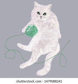 the cat lies with a ball of thread