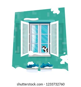 Cat looking through window. Merry Christmas holidays and xmas snowy nature. Happy New Year.