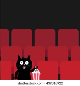 Cat in movie theater eating popcorn.  Cute cartoon character. Film show Cinema background. Viewer kitten watching movie. Red seats hall. Dark background. Flat design. Vector illustration