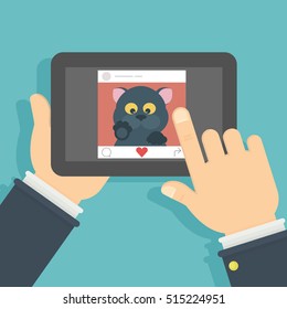 Cat On The Screen. Hand Holding Tablet With Funny Black Cat. Concept Of Internet Videos, Applications Or Social Networks.