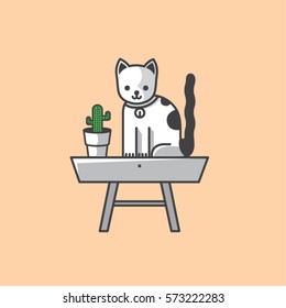 Cat on the table and cactus