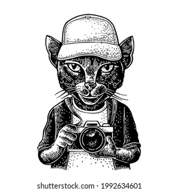 Cat Photographer Dressed In The Baseball Cap, T-shirt. Vintage Black Engraving Illustration. Isolated On White Background. Hand Drawn Design Element For Poster