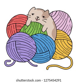 cat playing with balls of wool