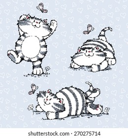 Cat plays with butterfly