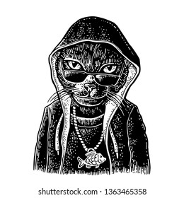 Cat rapper dressed in the hoodie, necklace with fish. Vintage black engraving illustration. Isolated on white background. Hand drawn design element for poster, t-shirt