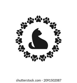 Cat silhouette inside round frame made of paw stamps. Pet shop logo. Not tested on animals stamp. No animal testing seal. Logo design with kitten or cat. Vector illustration isolated on white.