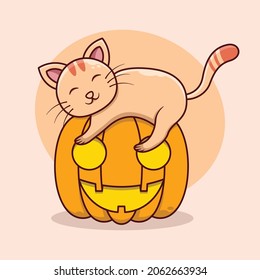 The cat sleeping on the halloween pumpkin. Cats celebrating halloween in october with halloween pumpkins.