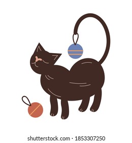 Cat standing and playing decorative colorful balls for decorating Christmas tree