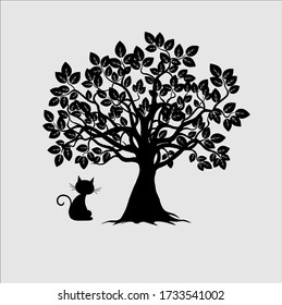 cat under a black big tree with leaves