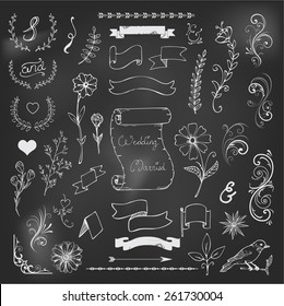 Catchwords, ribbons, ampersands design elements set on black board