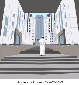 a Catholic priest, hands behind his back, passes under the arch of a skyscraper, climbs the steps to the city building.
