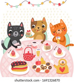 Cats at the party. Cake and tea. Celebration