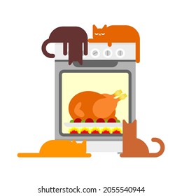 Cats and Turkey in kitchen oven. Preparing family Thanksgiving dinner. Festive traditional food