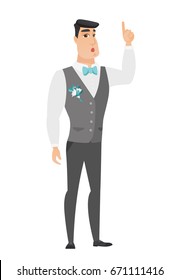 Caucasian bridegroom with open mouth pointing finger up. Full length of young bridegroom with open mouth came up with successful idea. Vector flat design illustration isolated on white background.