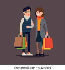 Caucasian couple doing fall season sale shopping. Man and woman in cold season outfits holding shopping bags. Cool vector character design on adult guy and girl with paper bags