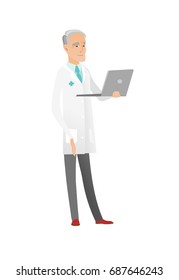 Caucasian doctor in medical gown using a laptop. Full length of senior doctor working on a laptop. Cheerful doctor holding a laptop. Vector flat design illustration isolated on white background.