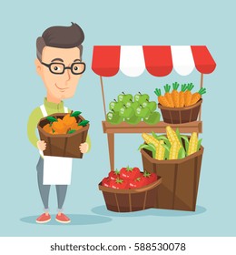 Caucasian greengrocer standing near stall with fruits and vegetables. Greengrocer standing near market stall. Greengrocer holding basket with fruits. Vector flat design illustration. Square layout.