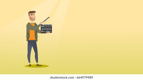 Caucasian man holding camera slate for the filming. Smiling hipster man holding open clapperboard. Cheerful man holding blank movie clapperboard. Vector flat design illustration. Horizontal layout.