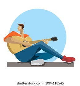 Caucasian musician sitting with the guitar in hands. Hipster man playing the acoustic guitar.