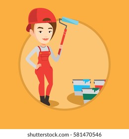 Caucasian painter in uniform holding paint roller in hands. Young house painter at work. Smiling painter standing near paint cans. Vector flat design illustration in the circle isolated on background.