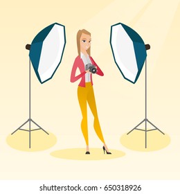 Caucasian photographer holding a camera in a photo studio. Photographer using a professional camera in a studio. Young photographer taking a photo. Vector flat design illustration. Square layout.