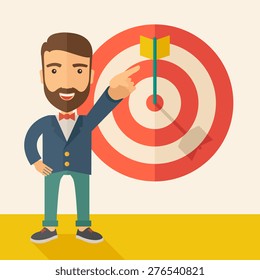 A Caucasian salesman happy standing while his hand pointing to the arrow from target pad shows that he hit his target sales. Business concept. A Contemporary style with pastel palette, soft beige