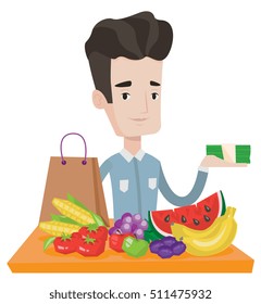 Caucasian shopper standing at the table with grocery purchases. Shopper holding money in hand in front of table with grocery purchases. Vector flat design illustration isolated on white background.