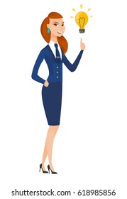 Caucasian stewardess pointing at bright idea light bulb. Full length of stewardess having a creatie idea. Concept of successful idea. Vector flat design illustration isolated on white background.
