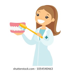 Caucasian white dentist showing toothpaste and a toothbrush while standing next to a shining healthy tooth. Dentistry, medicine and tooth care concept. Vector cartoon illustration. Square layout.