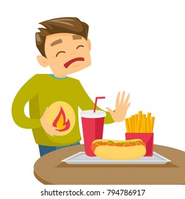Caucasian white man standing near table with fast food and having stomach ache from heartburn. Man suffering from a heartburn after fast food. Vector cartoon illustration isolated on white background.
